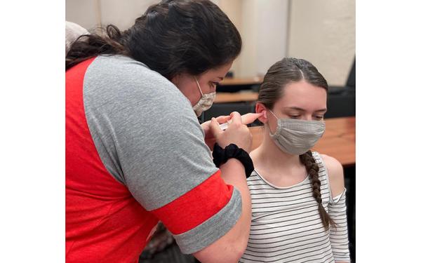 Students making ear mold impressions