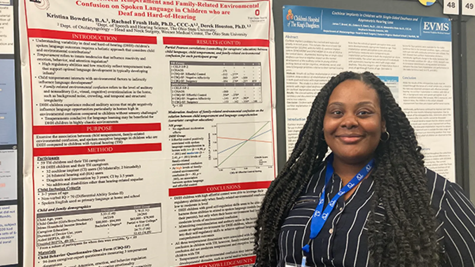 Kristina Bowdrie with research poster at conference