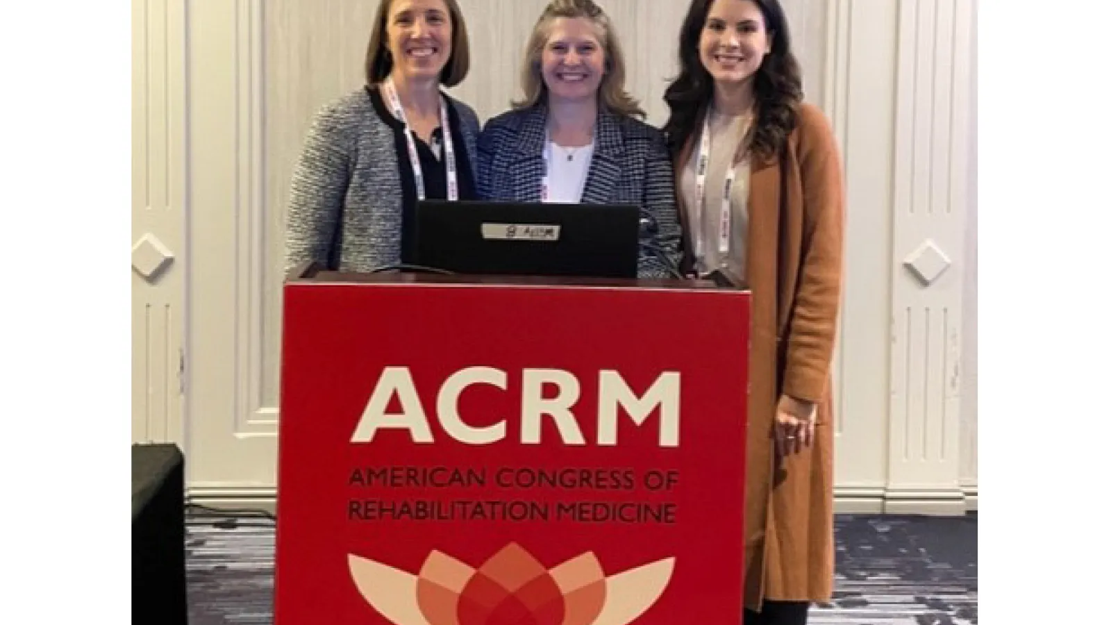 Dr. Lundine, Erika Hagen, and Nicole Viola presenting research