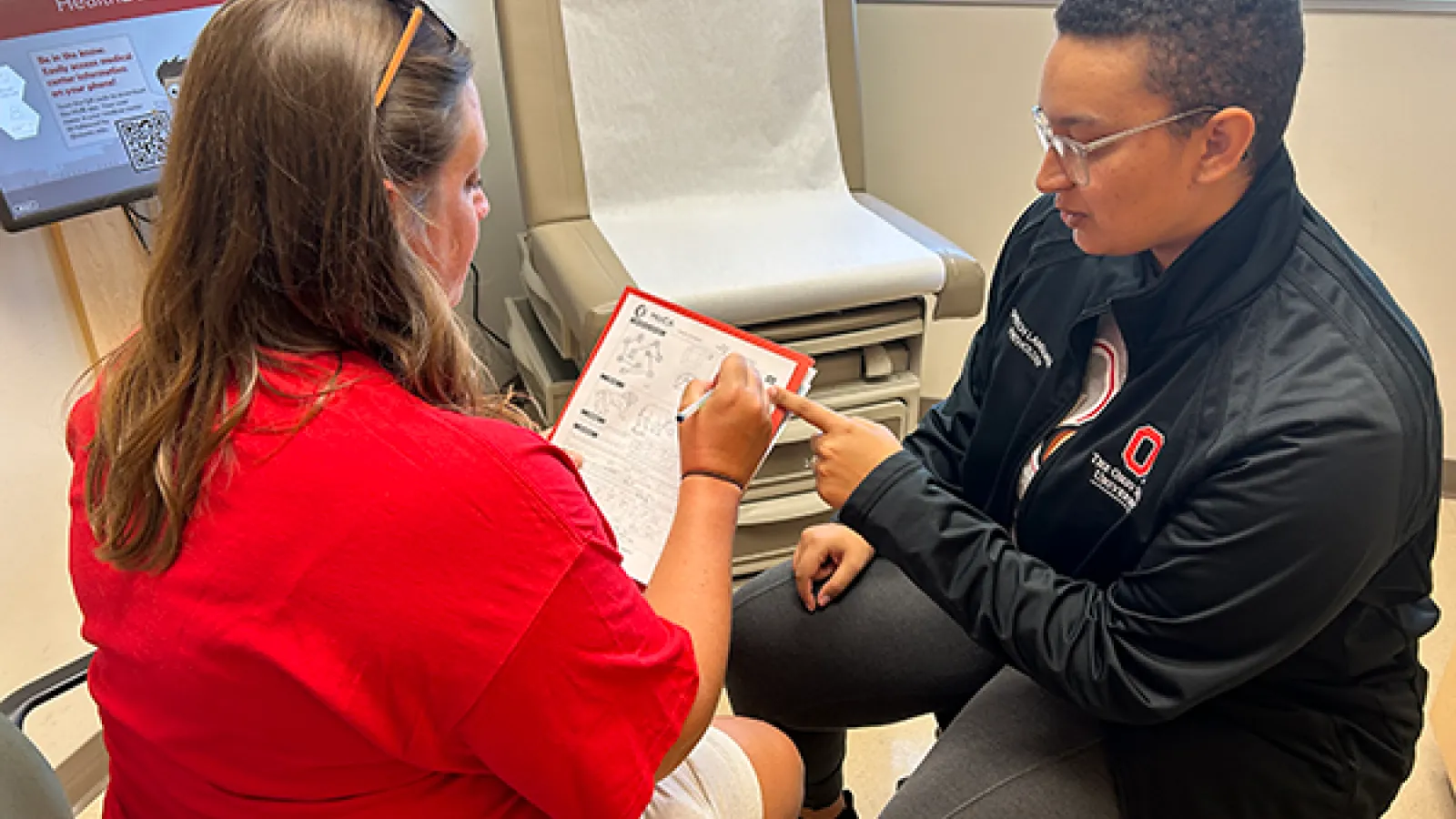 Patient receiving screening with Cheyenne Marshall