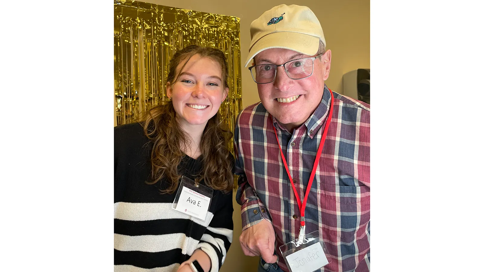 Student clinician and client smiling together