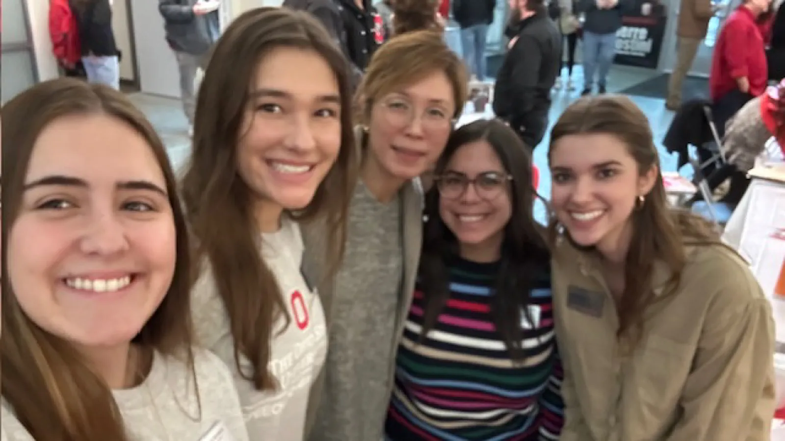 Group selfie of students, faculty, and staff