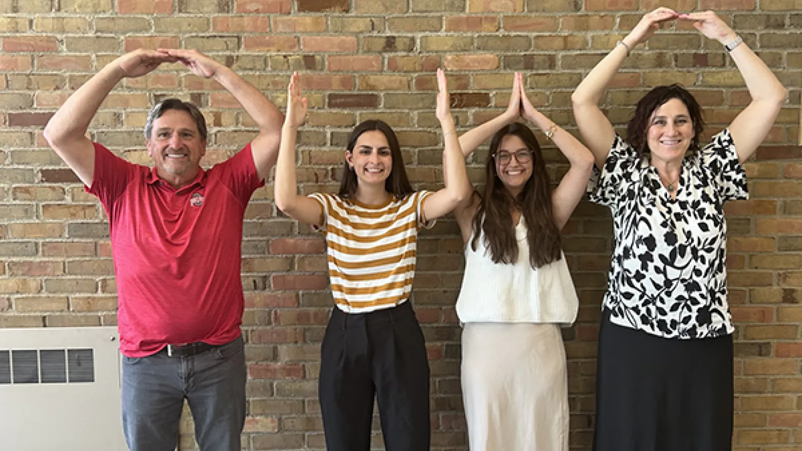 Tom Meadows, Rachel Kickbusch, Quinn Baumgartner, and Amy Sonntag in O-H-I-O pose