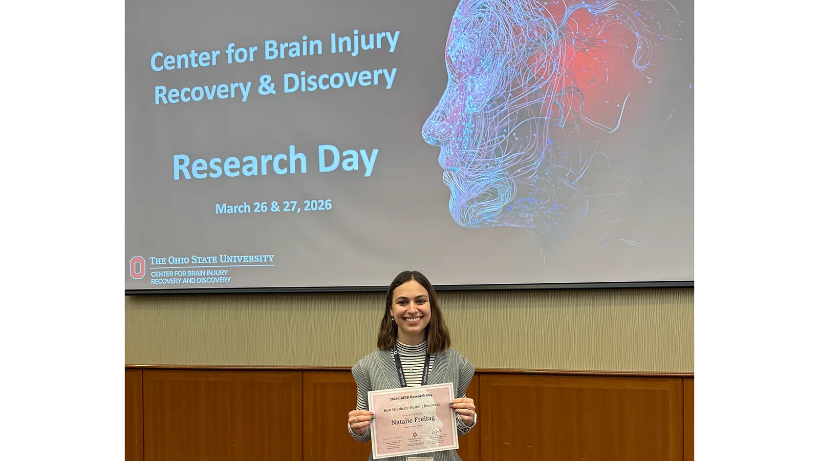 Natalie Freitag holding award