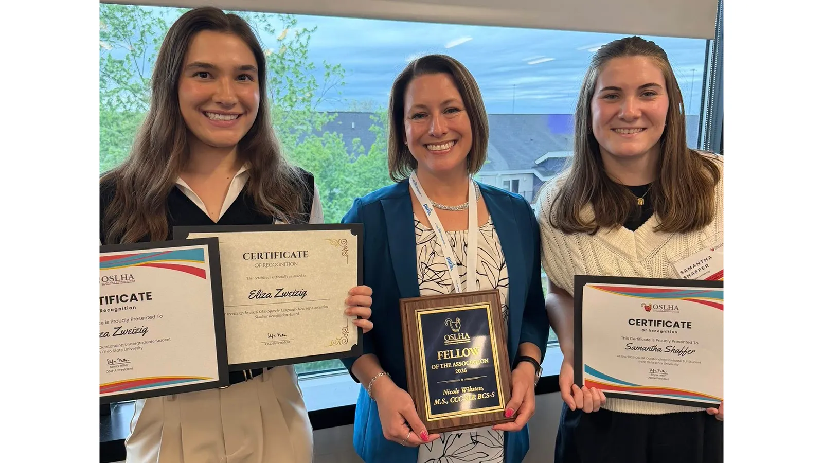 Eliza Zweizig, Nicole Wiksten, and Sami Shaffer holding awards