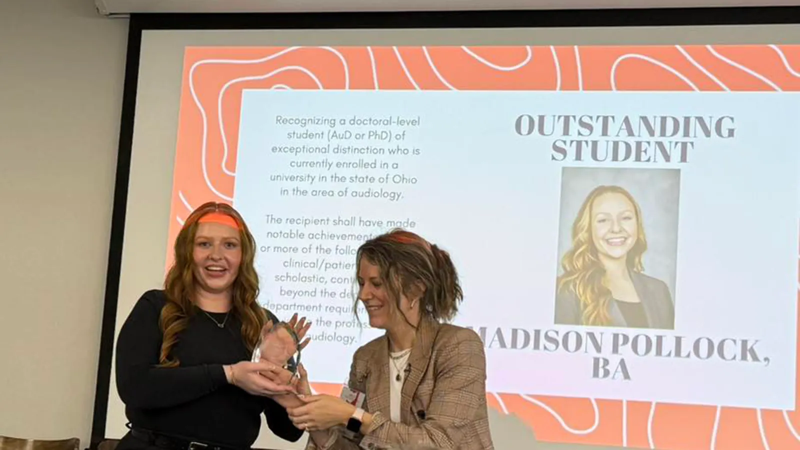 Madison Pollock receiving award from Dr. Krueger