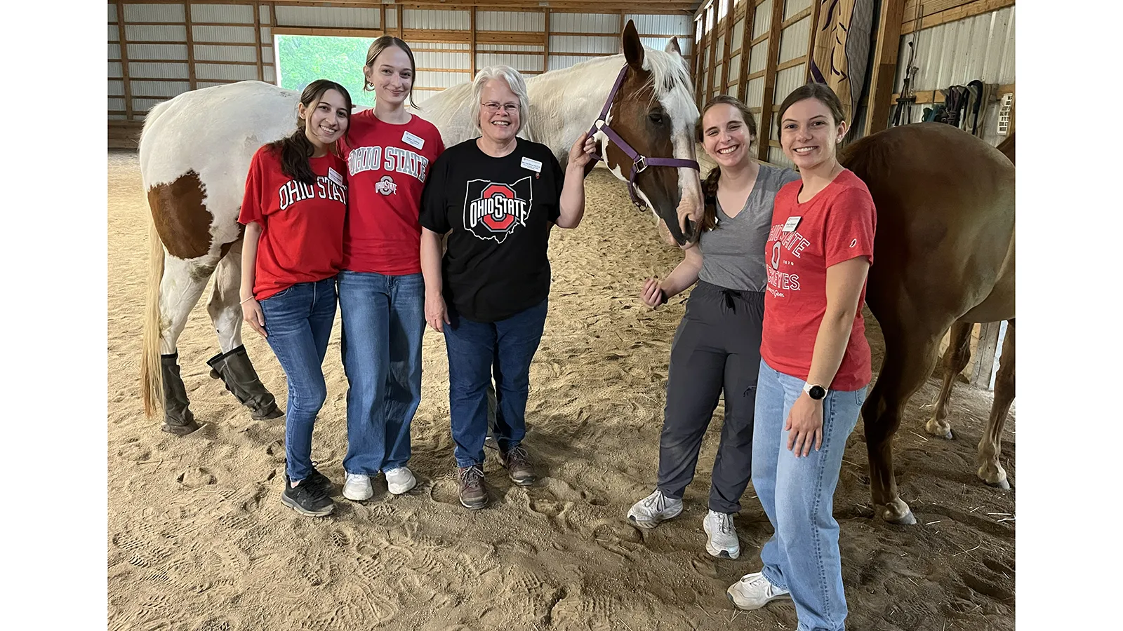 group photo of students with horses