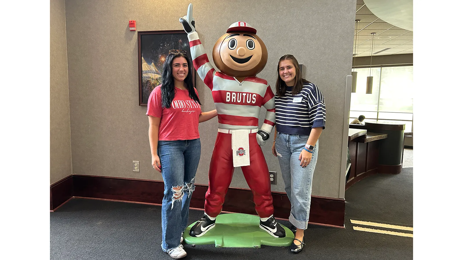 Arianna Bagheri and Leah Brown next to Brutus statue