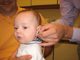 A baby's ear being examined