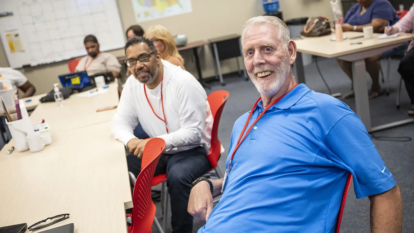 Aphasia clients seated at classroom tables