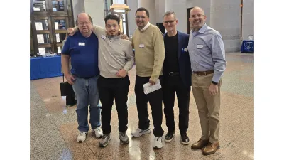 5 people posing for a group photo in the Ohio State House lobby