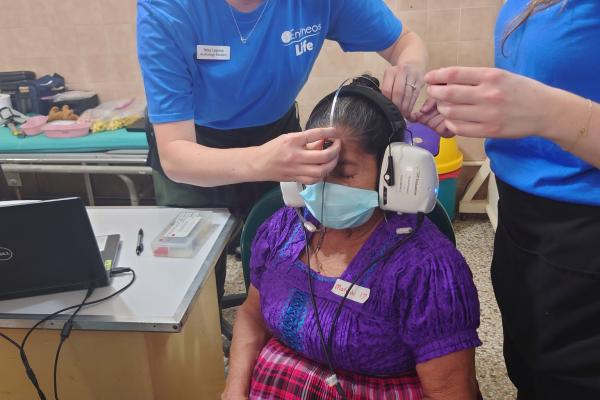 Haley Laycock conducts hearing screening on Guatemalan patient