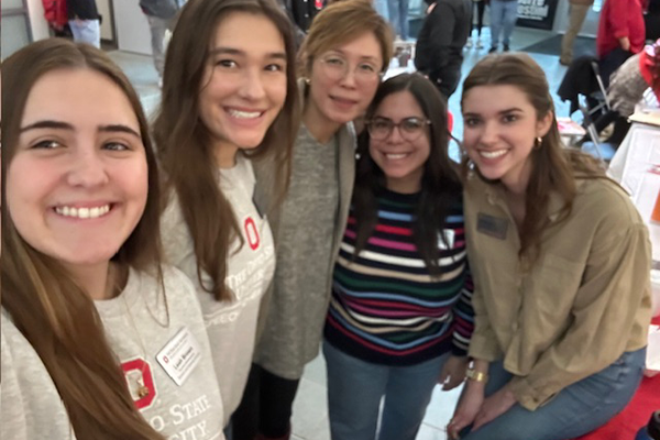 Group selfie of students, faculty, and staff