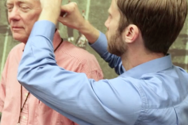 Man getting fitted for a hearing aid