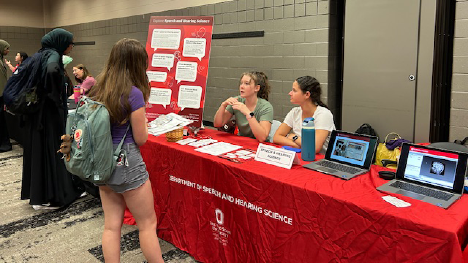 Students visiting information table