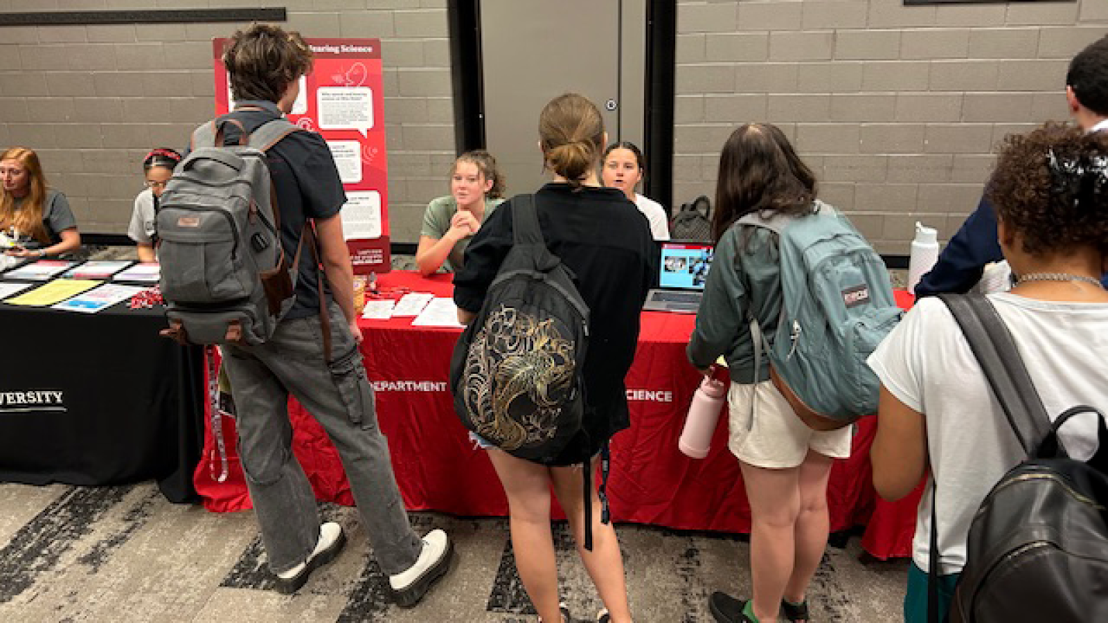 Students line up to talk with ambassadors at SHS table