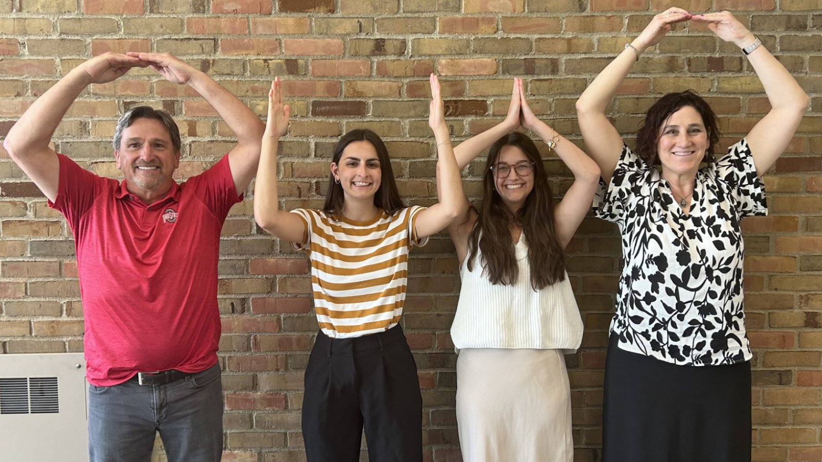 Tom Meadows, Rachel Kickbusch, Quinn Baumgartner, and Amy Sonntag in O-H-I-O pose