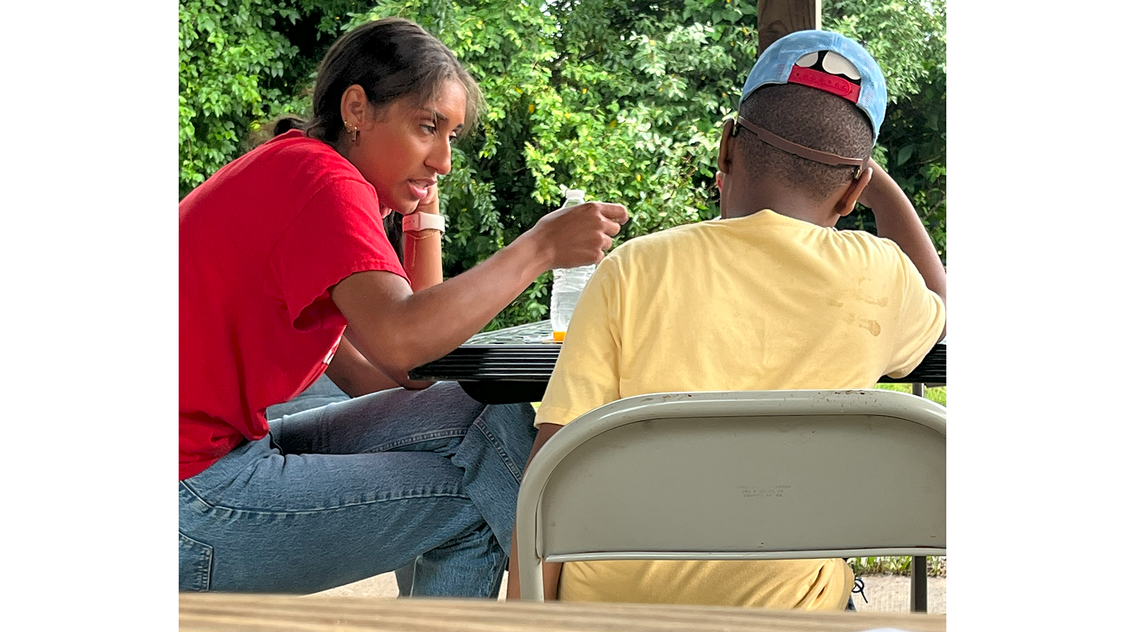 Graduate student working with child