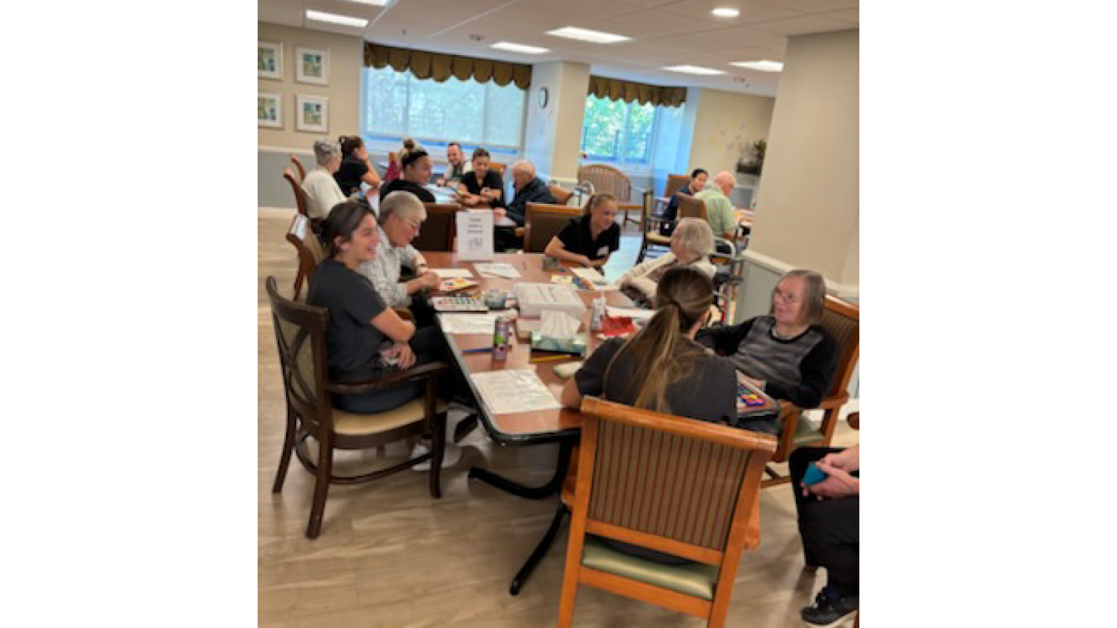 several students and patients making art together in a room