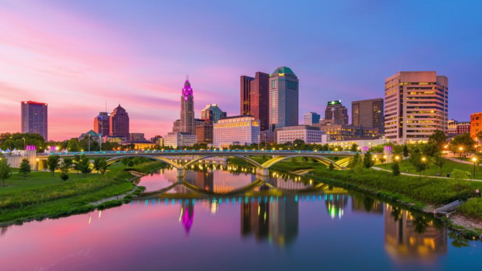 Columbus skyline at dusk reflected off river