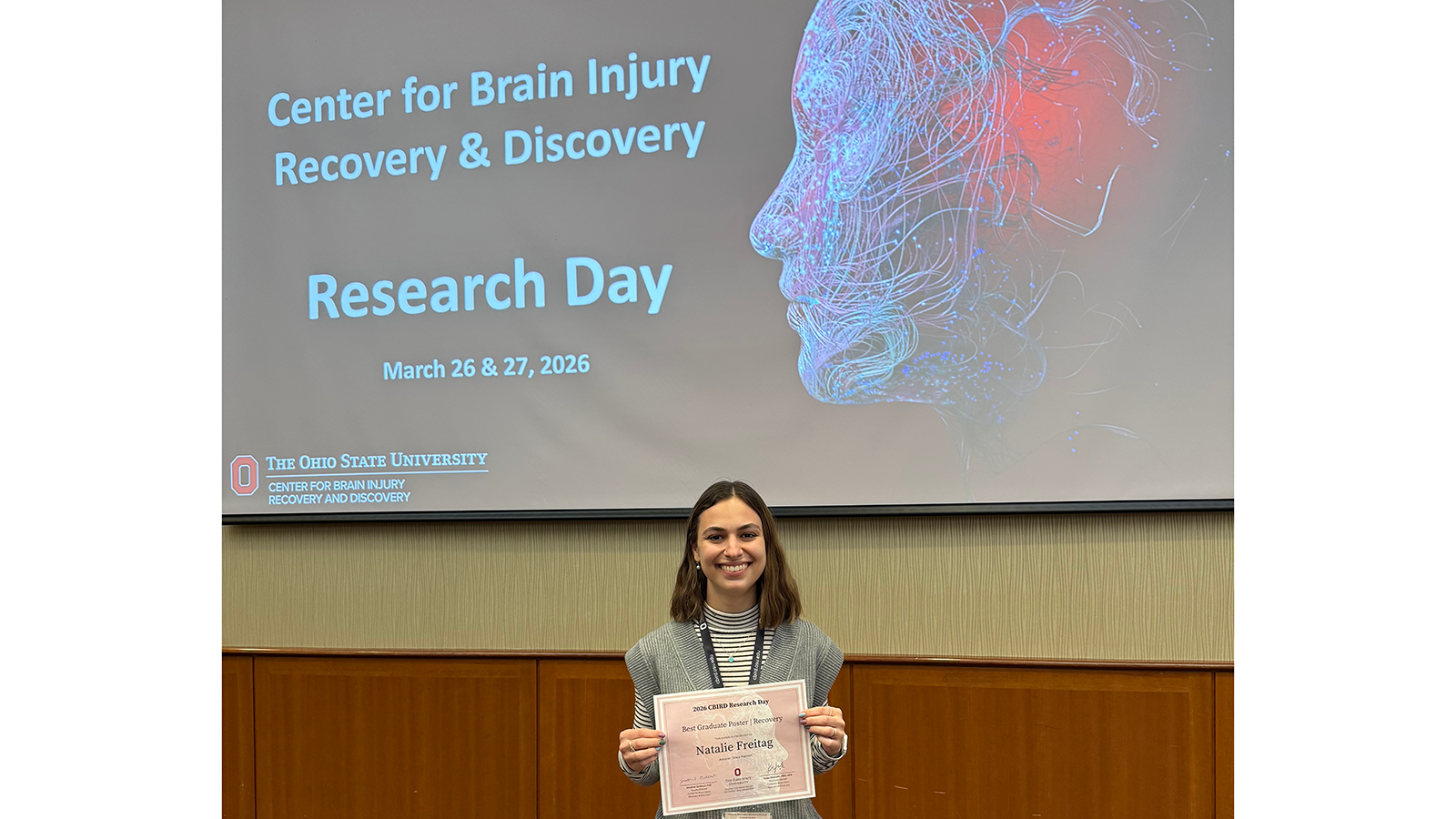 Natalie Freitag holding award